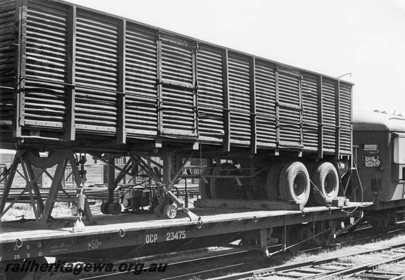 P03258
QCP class 23475 flat top wagon with road trailer load.
