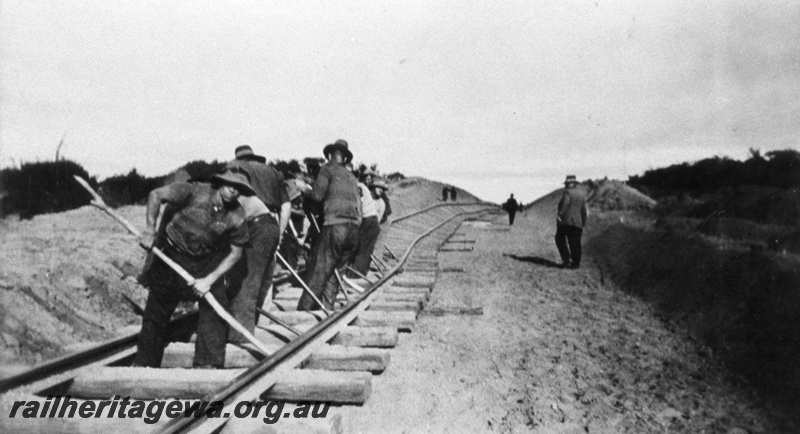 P03262
Track gang working on the regrading of the line, Indarra, NR line, c1934.
