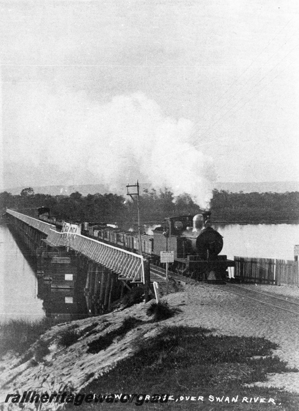 P03279
O class steam locomotive on goods train on Bunbury bridge, East Perth, SWR line, c1897.
