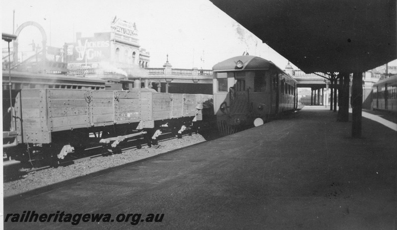 P03402
ASA class 445 Sentinel steam railcar, end and side view, GB class open wagons, passenger platform, Perth station, ER line.
