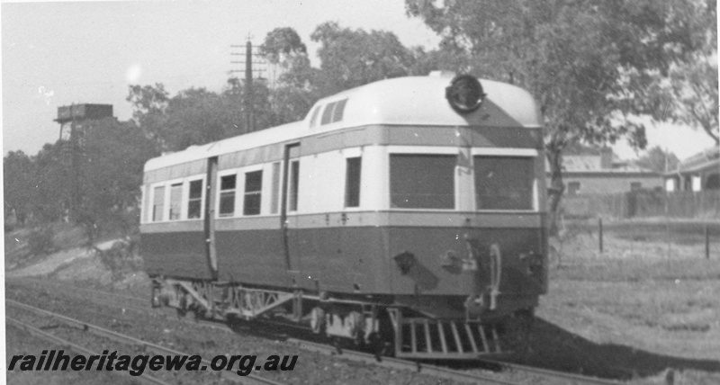 P03404
ADE Governor class diesel electric railcar, side and front view, water tower in the background, ER line.
