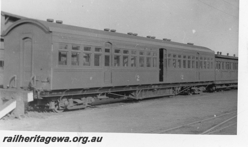 P03448
AY class 28 second class suburban saloon carriage, end and side view, buffer stop, c1930s.
