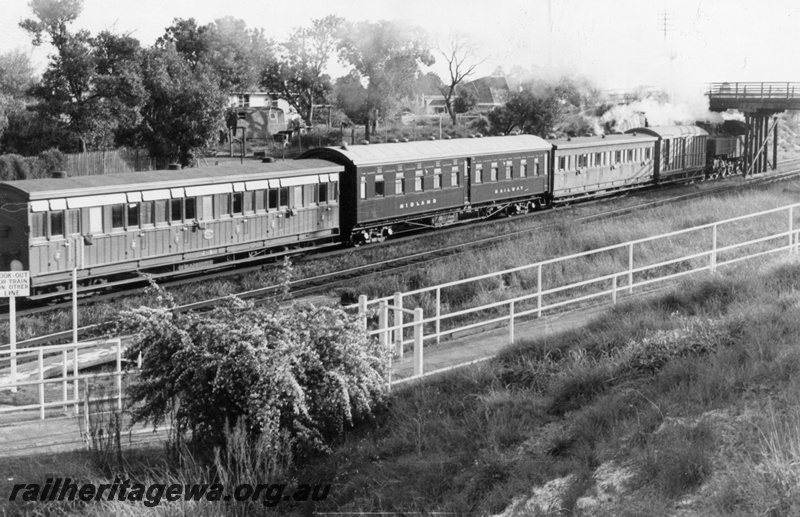 P03450
J class 6 ex MRWA carriage, JV class 32 ex MRWA corridor sleeping carriage, side view, on a train at Success Hill, ER line, c1964. 
