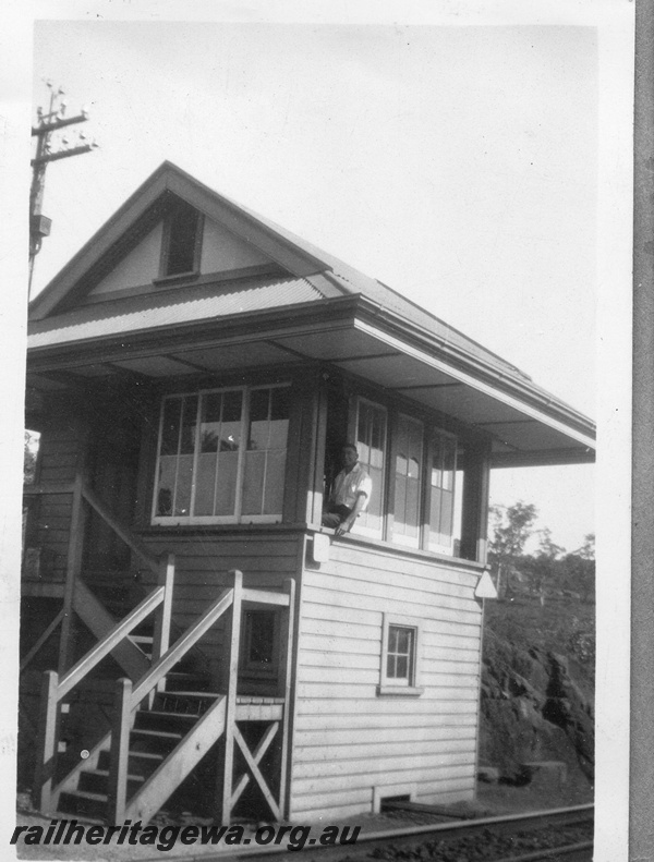 P03451
Signal box, Tunnel Junction, just east of the Swan View tunnel, ER line, view from trackside, signalman A.E. Risley leaning out of window
