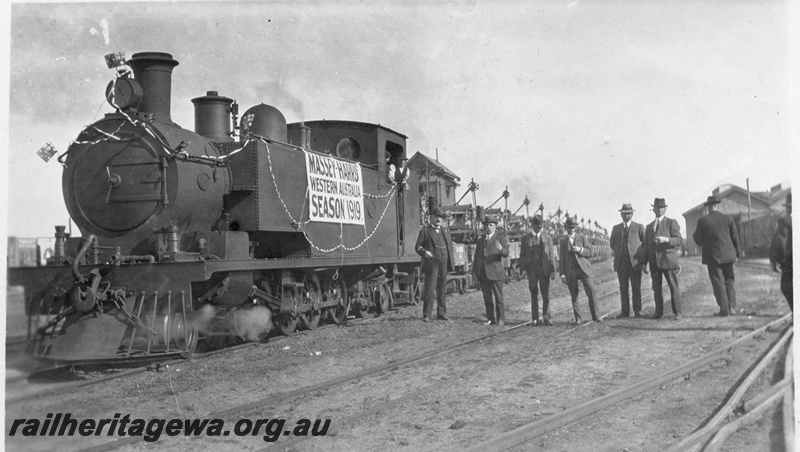 P03452
1 of 3, K class 186 steam locomotive hauling a special Massey-Harris farm machinery train, signal box in the background, front and side view, North Fremantle, ER line.
