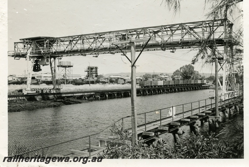 P03464
Coal dam, gantry, rake of coal wagons, coal stage, water tower, Midland, view looking east.
