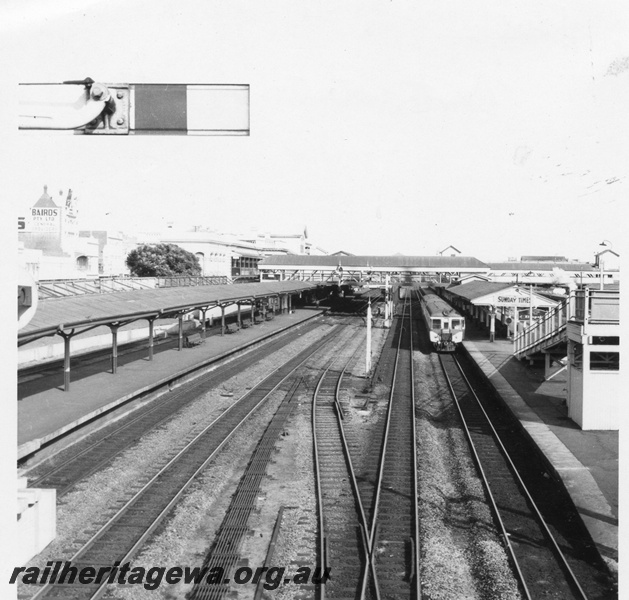 P03488
Perth station, view from the Barrack street Bridge looking west, railcar set at platform 6, overall view of the precinct..

