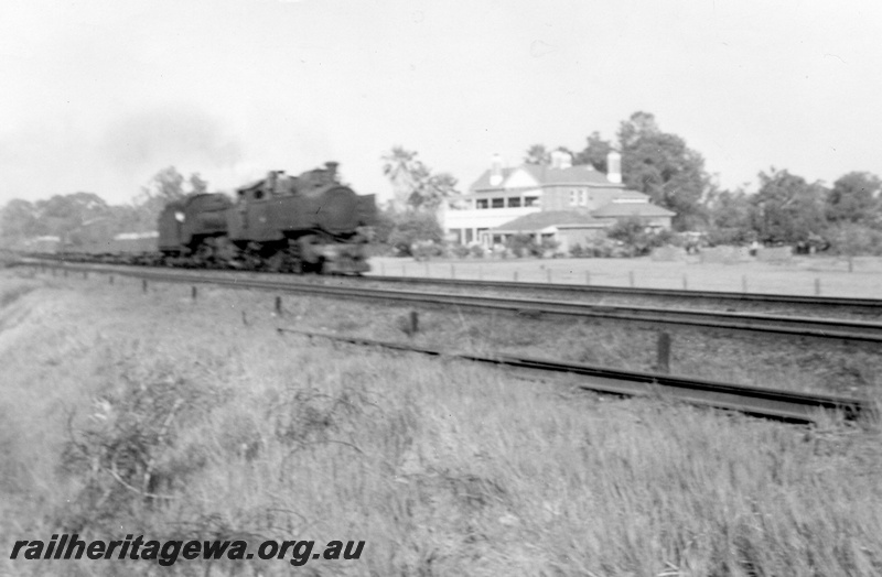 P03502
DD class and U class steam locomotives double heading on a goods train, side and front view, near Guildford, ER line.
