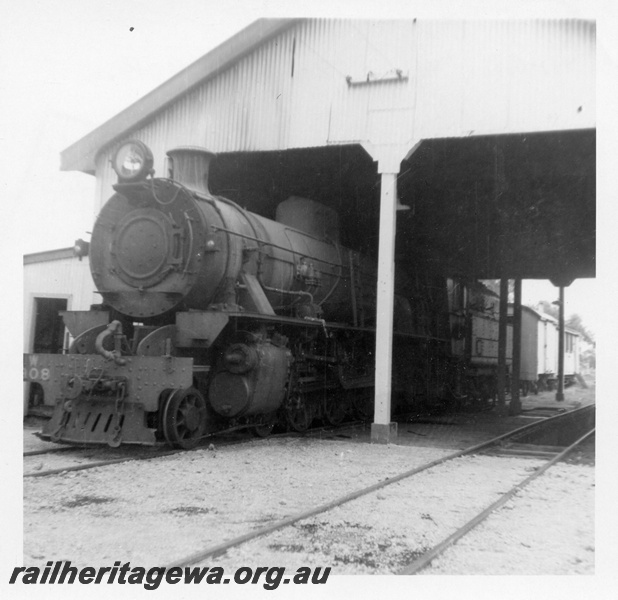 P03601
W class 908 steam locomotive, front end sticking out of the loco shed, Busselton, BB line.
