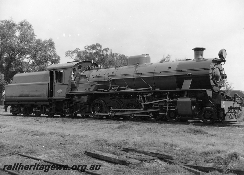 P03605
W class 901 steam locomotive in as new condition, side and front view, ASG in the background, c1951.
