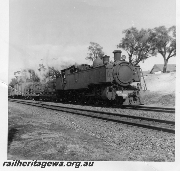 P03607
DM class 585 steam locomotive on side and front view, on goods train, passing East Perth sheds, ER line.
