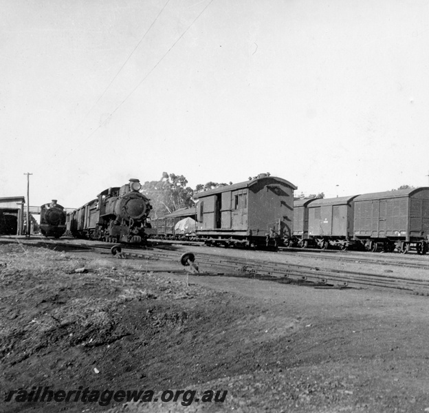 P03702
E class loco, on goods train, ZB class brakevan van, Armadale station, SWR line
