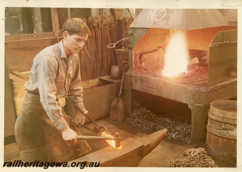 P03732
Apprentice blacksmith, Blacksmith Shop, Block 2, Midland Workshops, See also P03731

