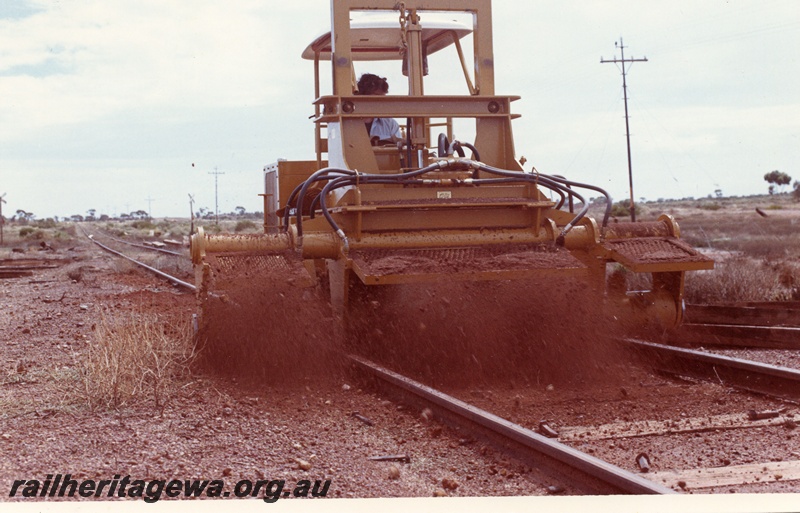 P03769
2 of 4: Tamper machine on standard gauge north of Kalgoorlie, end on view.
