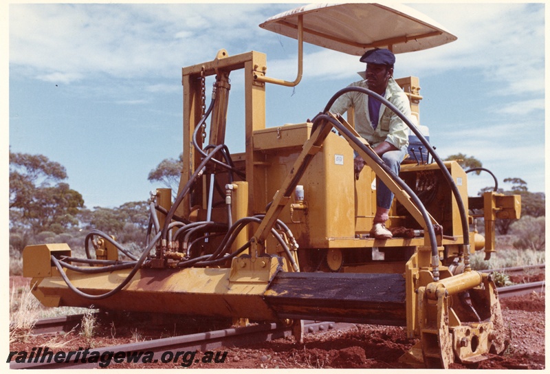 P03770
3 of 4: Tamper machine on standard gauge north of Kalgoorlie, front and side view.
