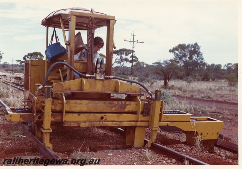 P03771
4 of 4: Tamper machine on standard gauge north of Kalgoorlie, front view.
