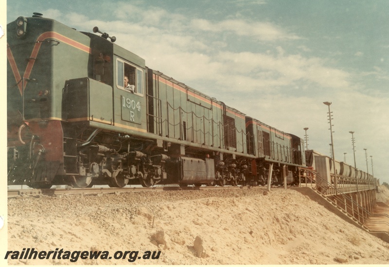 P03791
R class 1904, green with red and yellow stripe, double heading bauxite train, on bridge, Kwinana
