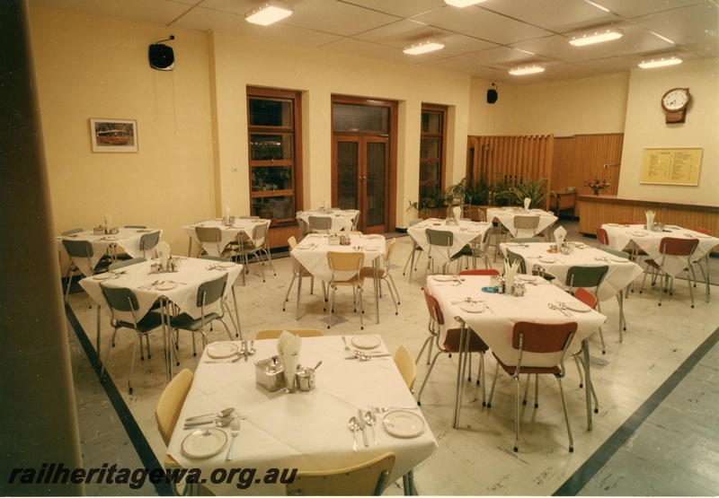 P03811
1 of 2 photos of Dining room interior, tables set, looking towards wall with clock and price list, Perth City station, ER line
