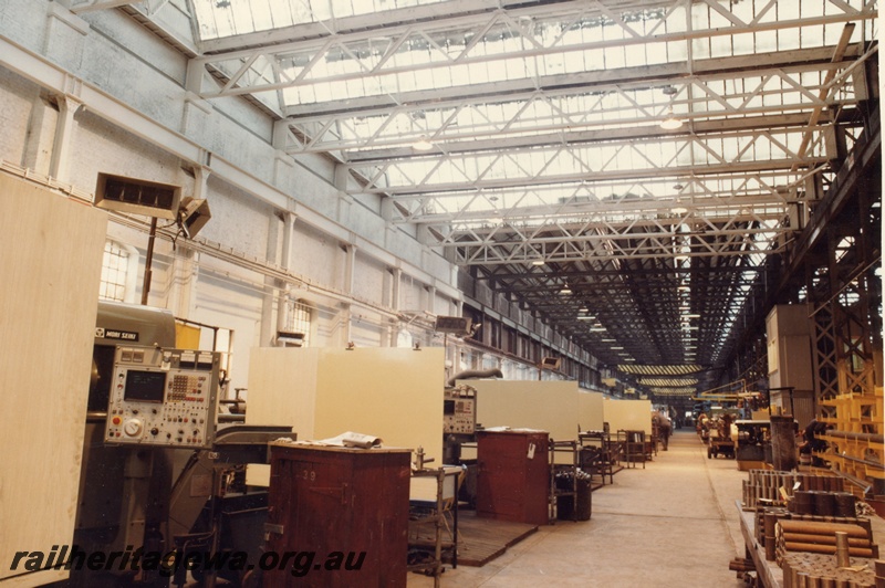 P03855
Machine shop, Block 3, Midland Workshops. View the length of the machine shop with numerical lathes on the left side. 
