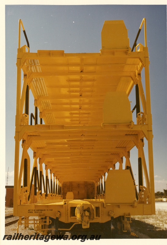 P03902
3 of 5, WMB class 34029 triple deck standard gauge motor vehicle carrying wagon, end view, in as new condition, in yellow livery, Forrestfield.
