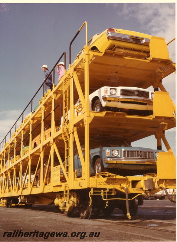 P03903
4 of 5, WMB class 34029 triple deck standard gauge motor vehicle carrying wagon, loaded with cars, side and end view, in as new condition, in yellow livery, North Fremantle.
