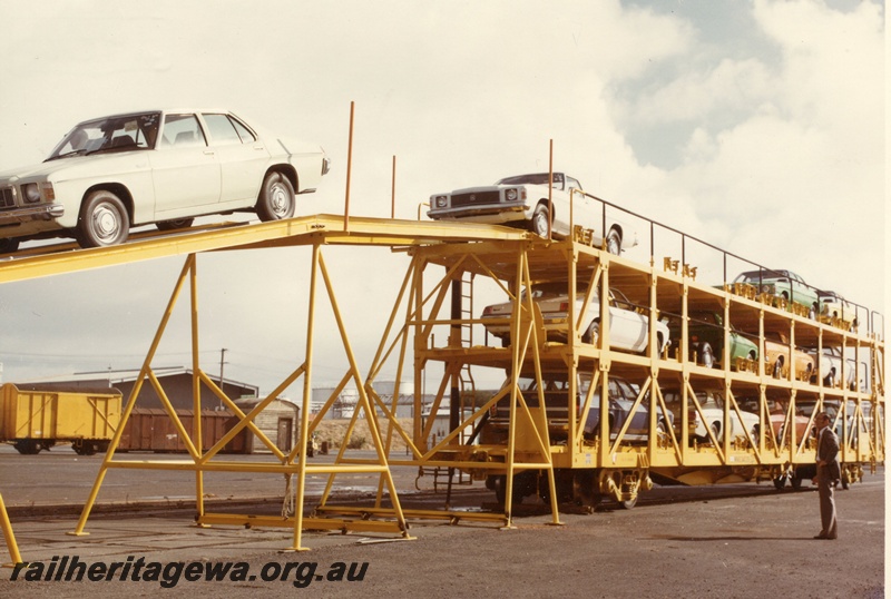 P03904
5 of 5, WMB class 34029 triple deck standard gauge motor vehicle carrying wagon, unloading cars, end and side view, in as new condition, in yellow livery, North Fremantle.
