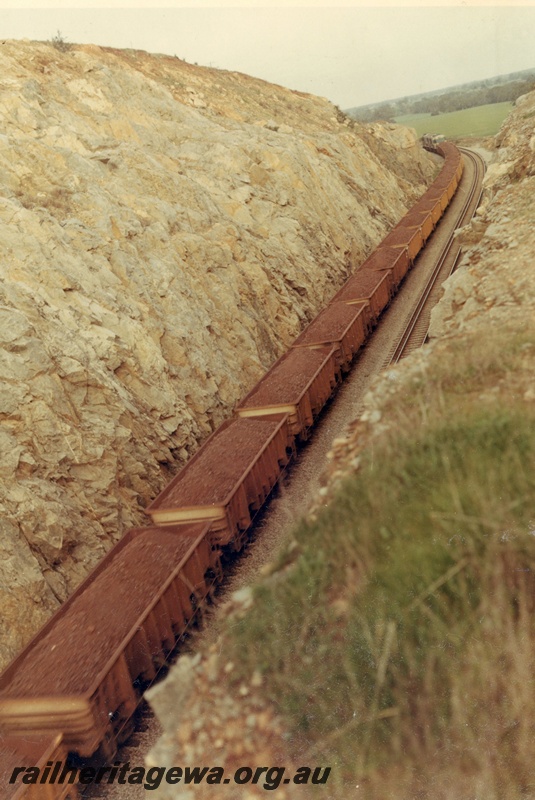 P03931
WO class iron ore wagons being hauled through Windmill Hill cutting, Avon Valley, elevated view, standard gauge railway.
