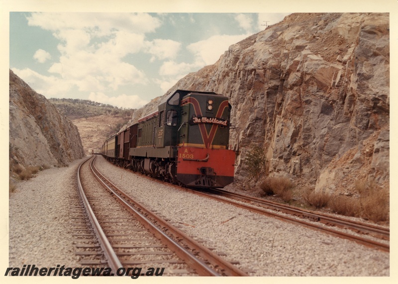 P03962
A class 1503 diesel locomotive in green with red and yellow stripe livery hauling 