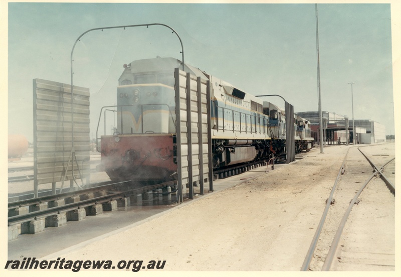 P03965
1 of 2, L class 267 standard gauge diesel locomotive in dark blue livery, going through the washing machine, Forrestfield.
