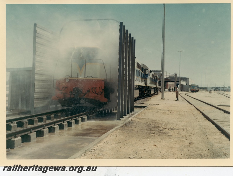 P03966
2 of 2, L class 267 standard gauge diesel locomotive in dark blue livery, going through the washing machine, Forrestfield.
