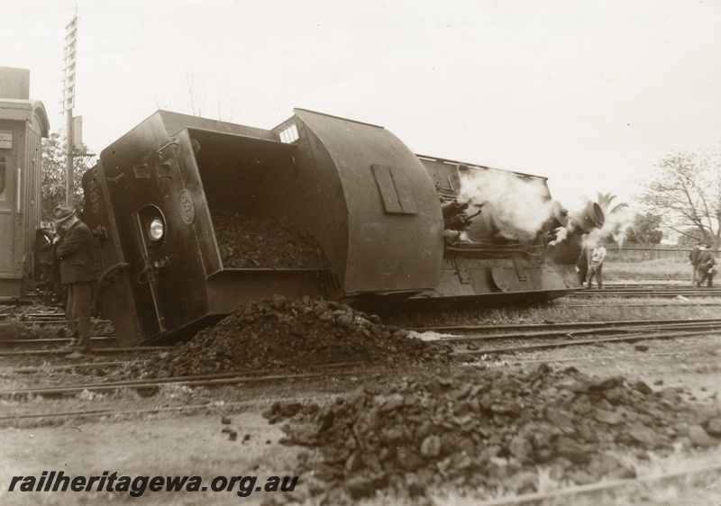 P04056
DM class 585 on No. 195 Passenger, derailed and resting on side, at Midland Junction, ER line, view of top of loco from track level, date of derailment 30/7/1953
