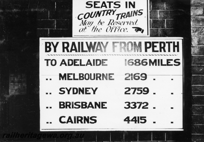 P04085
Mileage board showing distances of capital cities from Perth, Perth Station, also a notice advising that seats on country trains could be reserved at the office 
