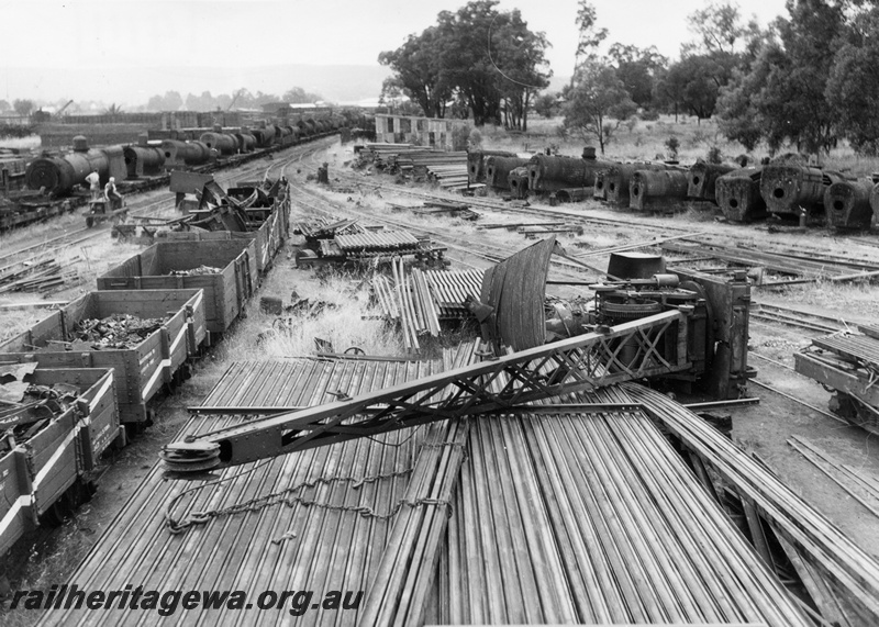 P04111
Derailment, steam crane lying on its side, Midland rail yard, assorted wagons and steam boilers, ER line
