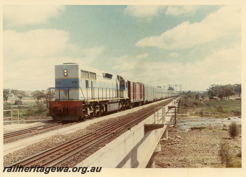 P04167
2 of 5 L class 264 in original livery, long hood leading hauling the 