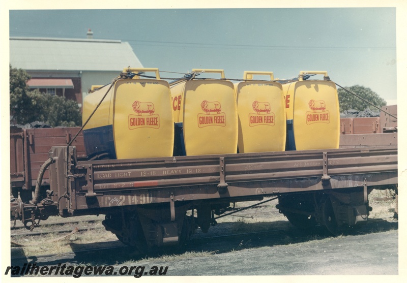 P04186
HC class 21490 low-sided wagon loaded with Golden Fleece petrol containers, side view.
