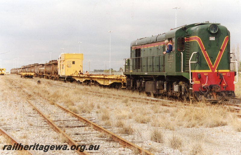 P04255
Hotham Valley Railway C class 1703, attaching QUG wagons to the rear of 18 wagon rake of oil tankers, Forrestfield
