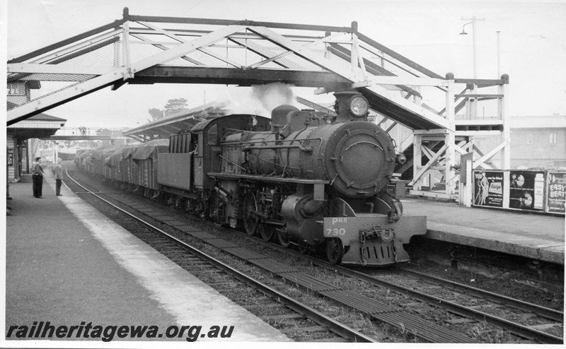 P04337
PMR class 730 steam locomotive, side and front view, on fast goods train, going under the foot bridge, Subiaco, ER line.
