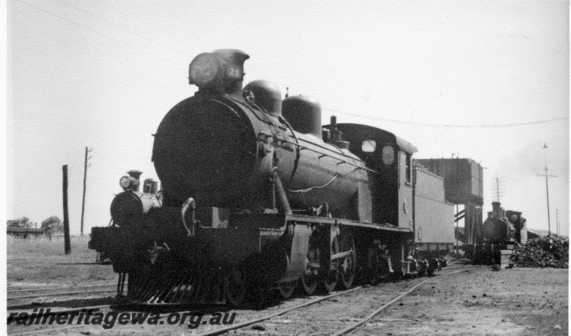 P04341
2 of 4, MRWA A class 29 steam locomotive, front and side view, water tower and two other steam locos in the background.
