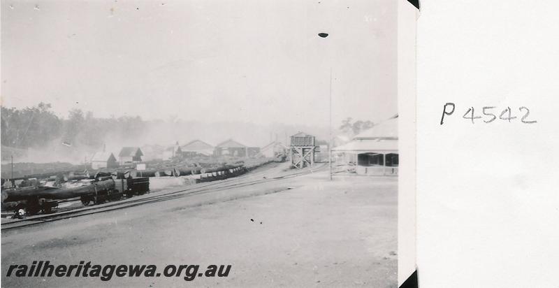 P04542
Jinker with a log load, wooden water tower, mill, Jarrahdale, overall view of the mill,
