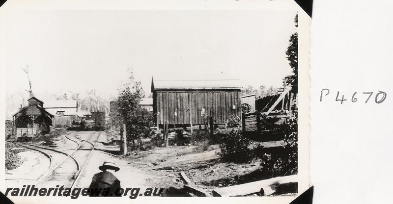 P04670
General view of a mill site showing a loco shed and other buildings
