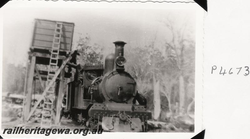 P04673
Millars G type loco, wooden tank on stand, taking water
