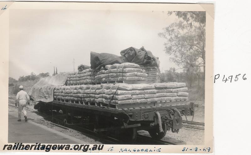 P04956
QCE class 23644 bogie flat wagon, Soundcem, being loaded with bags of cement for Kalgoorlie, a set of five photos
