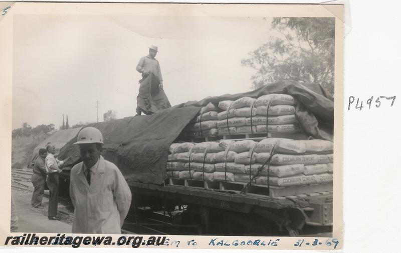 P04957
QCE class 23644 bogie flat wagon, Soundcem, being loaded with bags of cement for Kalgoorlie, a set of five photos
