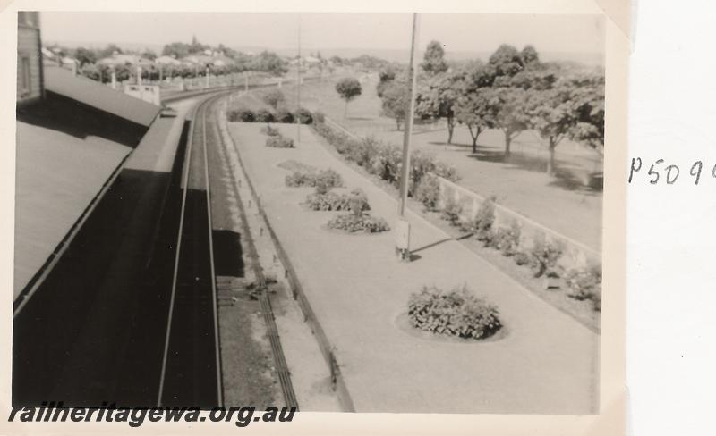 P05099
Station yard, Bassendean, showing part of the elevated signal box, elevated view looking east.
