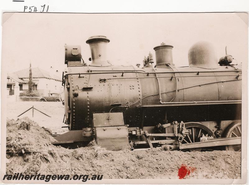 P05471
E class loco, derailed and front buried in dirt
