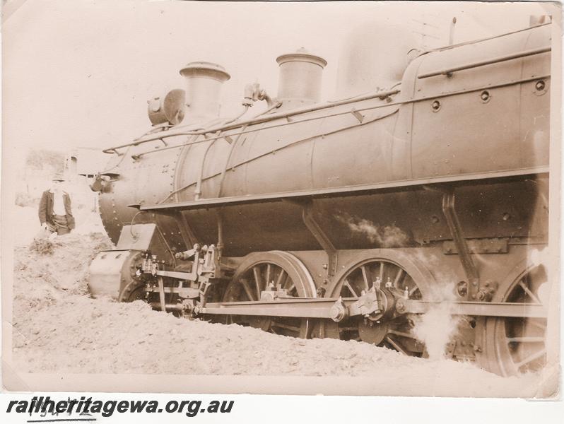 P05472
E class loco, derailed and front buried in dirt
