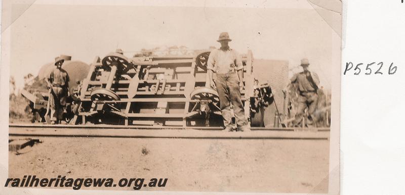 P05526
Derailment at Gillingarra, 76.25 mile, MR line, workers around derailed wagon
