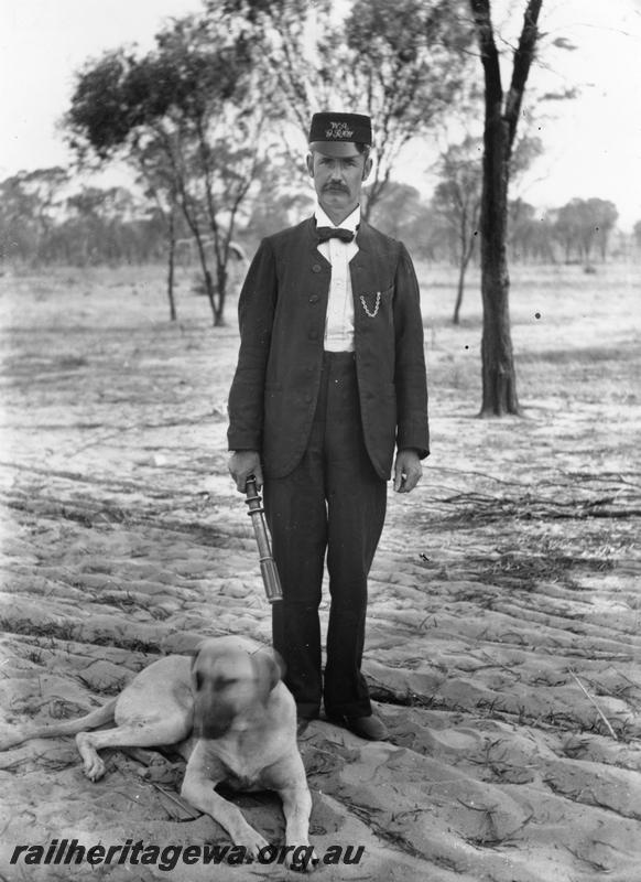 P05587
Station staff, Officer in Charge, EGR, posing with electric staff in hand 
