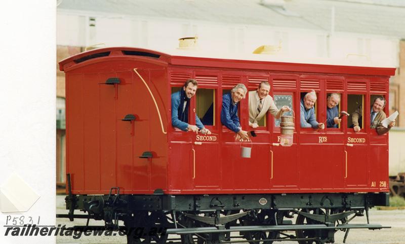 P05831
AI class 258, 4 wheeled carriage, Midland Workshops, recently restored, side view with workers leaning out of the windows.
