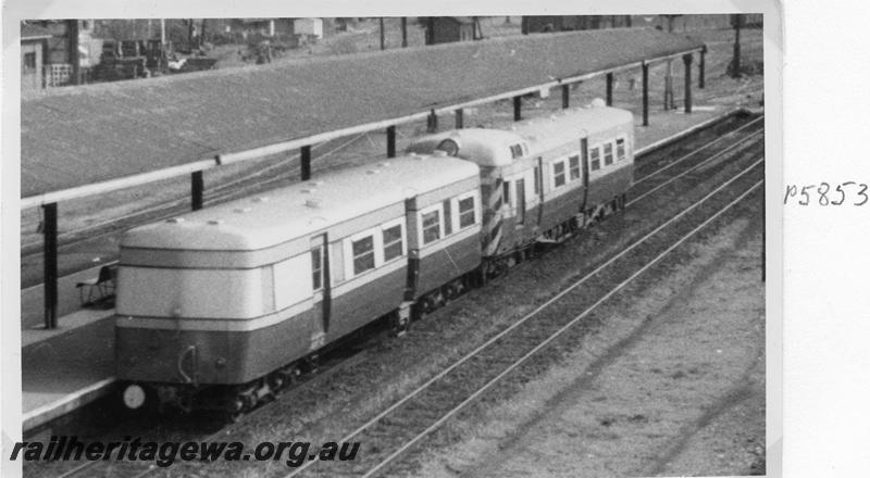 P05853
ADT class coupled to an ADE class railcar, Perth station, in original green and cream livery with black and yellow chevrons on front of the ADE
